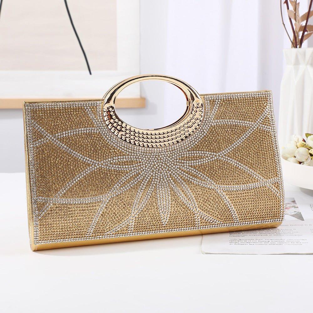 Vintage circular handle clutch bag in silver finish catching studio lighting