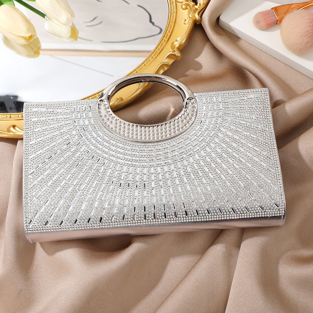 Rhinestone bridal clutch bag photographed in flatlay with floral accessories