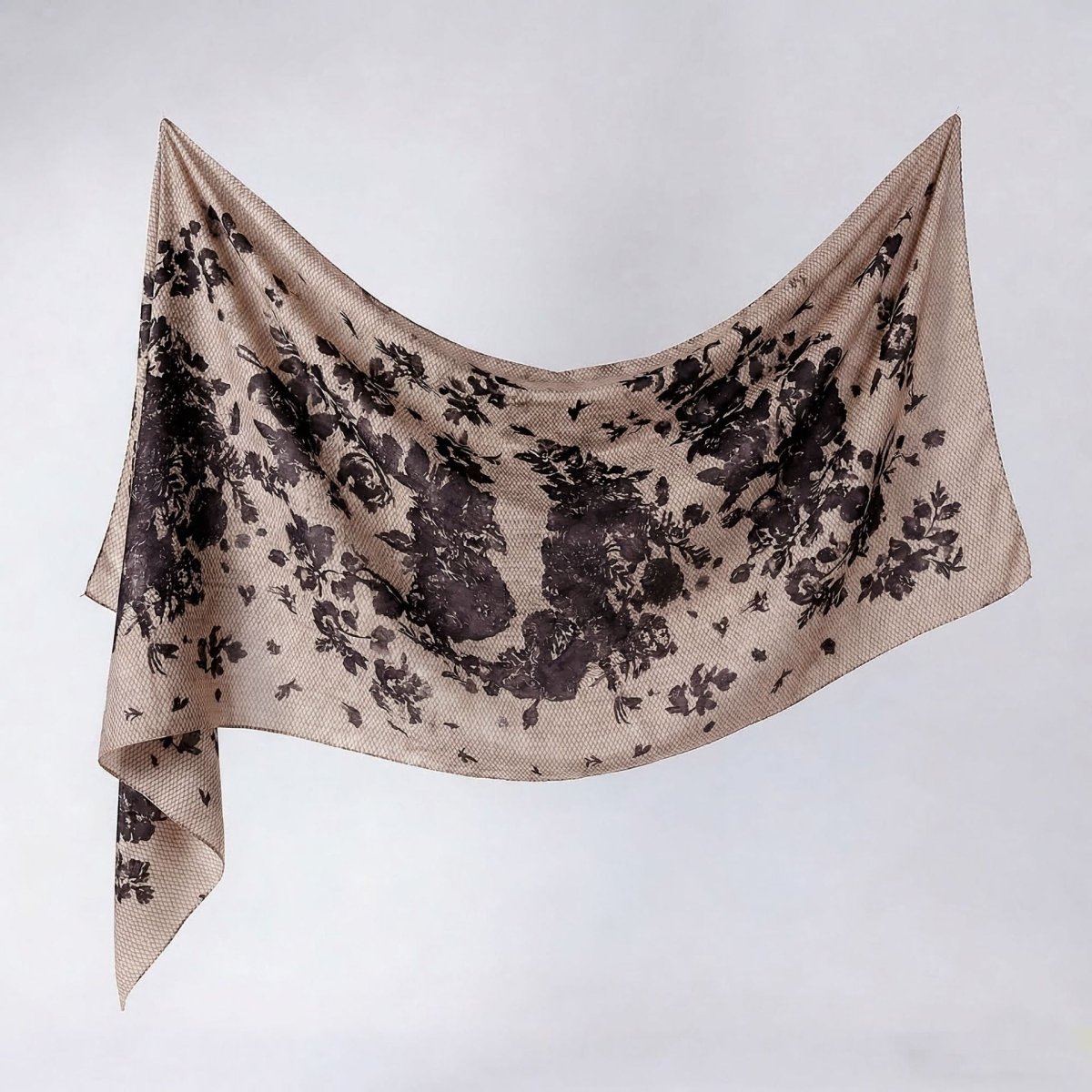 Oversized printed hijab shawl styled as a shoulder wrap, floral watercolour print