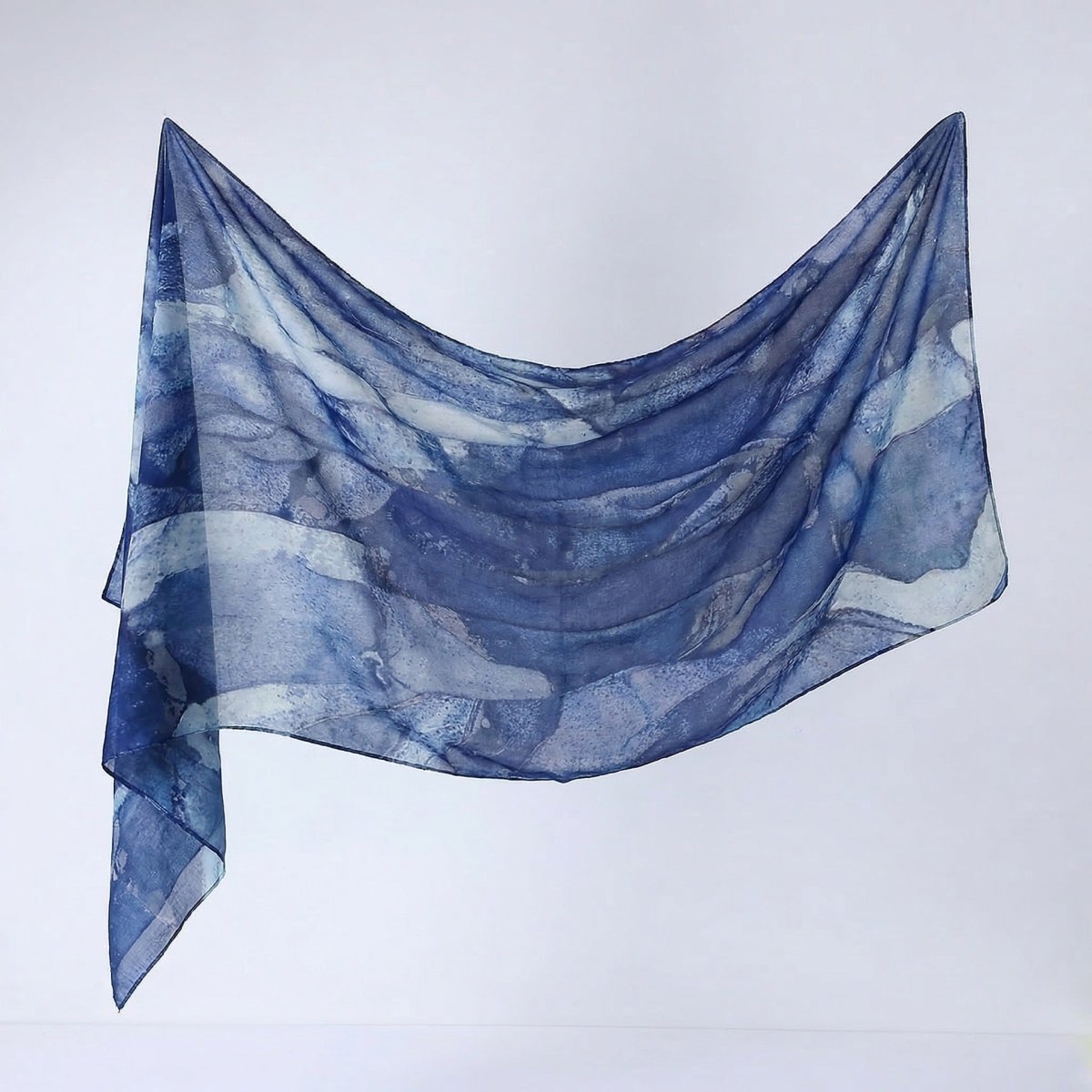 Side profile view of watercolour print hijab shawl worn as hijab